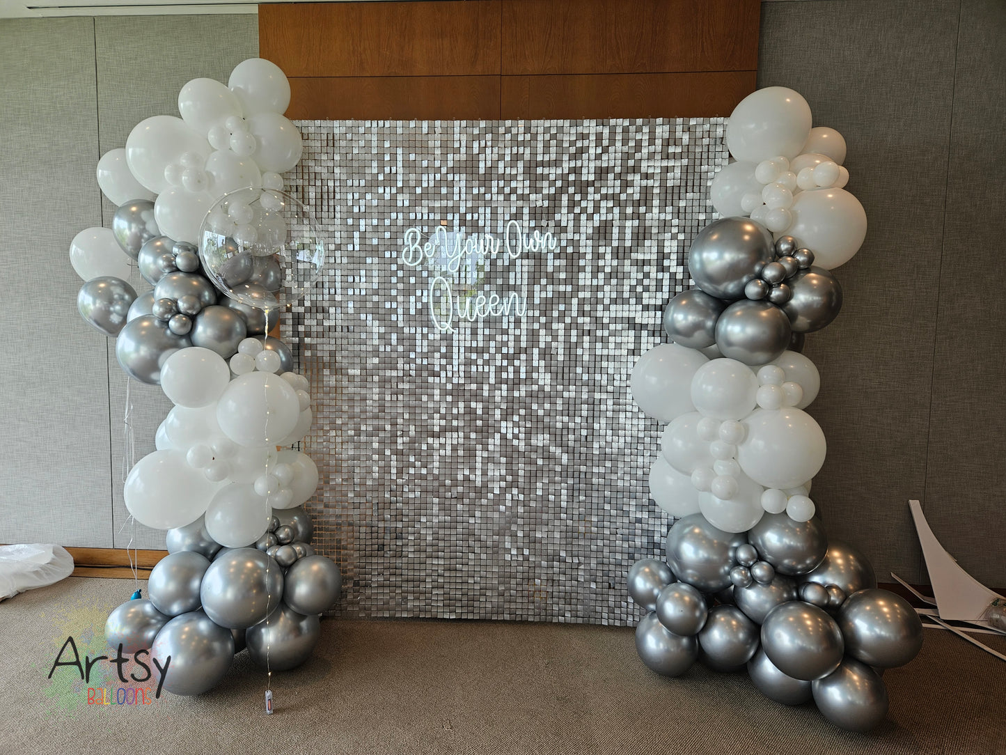 Silver Shimmer Backdrop with Organic Balloon Garland, Paper Plinth, LED Signage