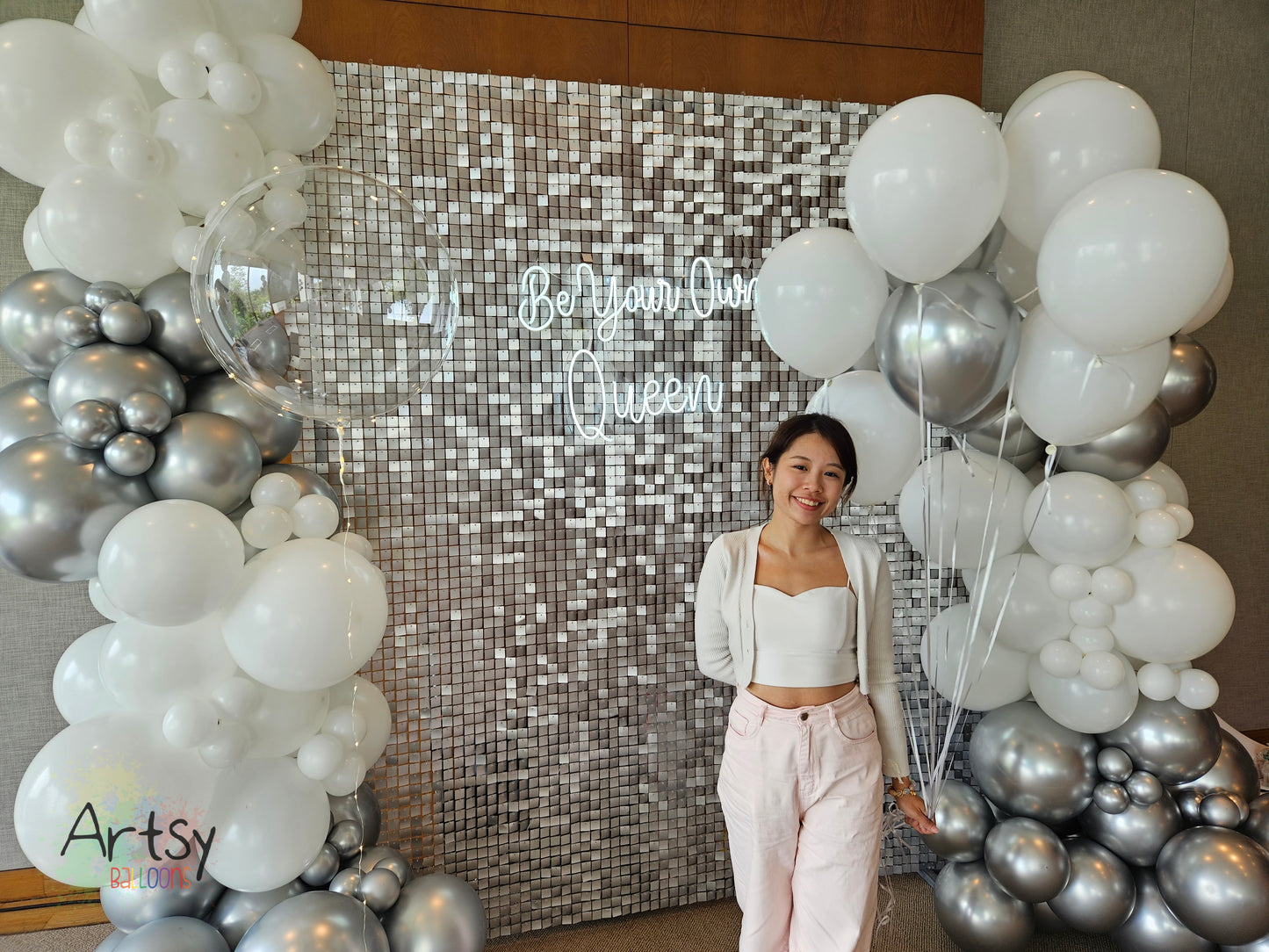 Silver Shimmer Backdrop with Organic Balloon Garland, Paper Plinth, LED Signage and Helium Balloon